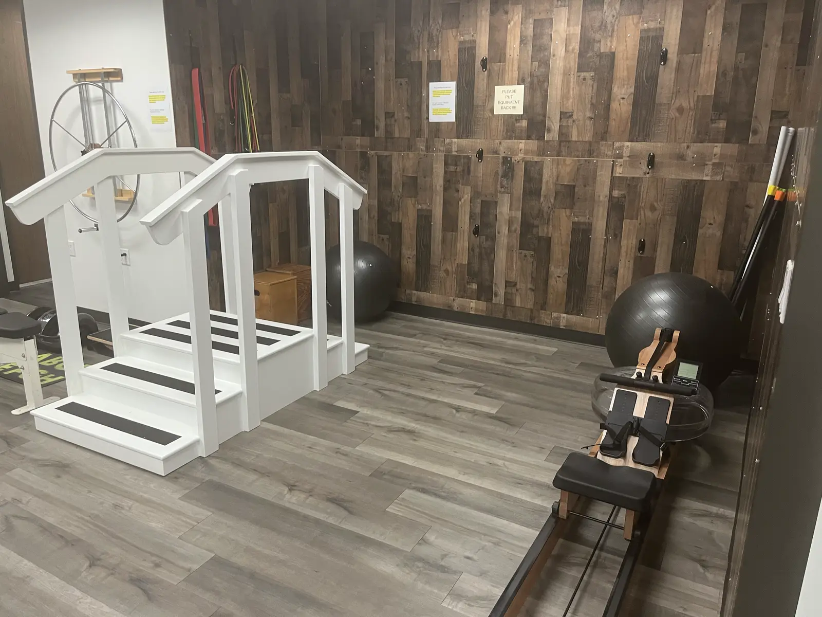 The training area with practice stairs, resistance bands and exercise balls